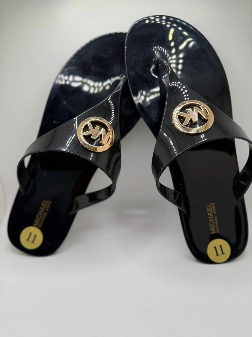 Michael Kors Black Patent Logo Jelly Thong Sandals with Gold Emblem